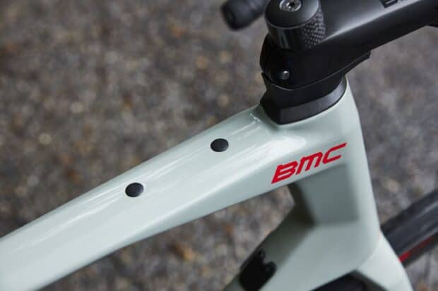 The image shows a close up of a modern BMC bike frame with the logo clearly visible, 2K Desktop Wallpaper