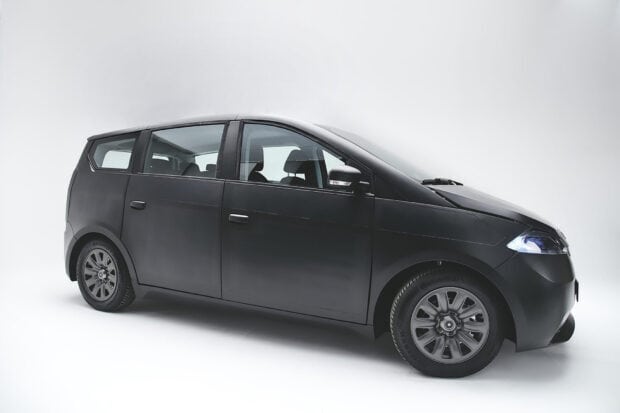 A sleek black Sono Motors vehicle is displayed in a studio with bright lighting, Sono Motors Wallpapers, HD Desktop Wallpaper