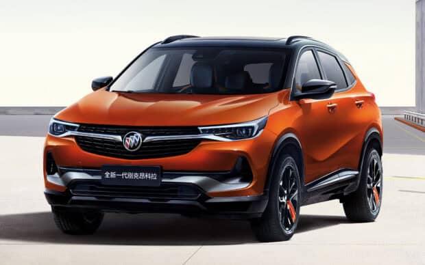 A bright orange Buick Encore with black accents parked outside, HD Desktop Wallpaper