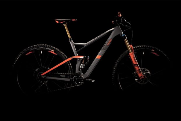 A modern Cube Bikes mountain bike features sleek gray and orange design against black, HD Desktop Wallpaper
