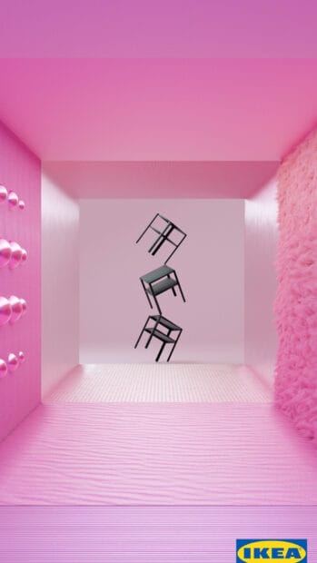 Three black Ikea chairs are stacked inside a pink textured room with creative lighting, HD Phone Wallpaper