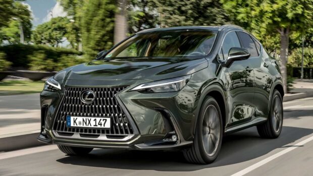 A sleek Lexus NX drives smoothly on an urban road with green trees lining the street, HD Desktop Wallpaper