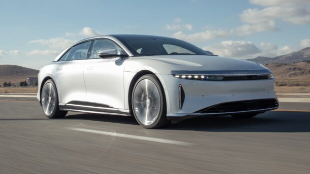 A sleek white vehicle driving on a clear road, HD Desktop Wallpaper