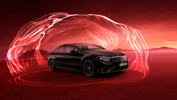 A black Mercedes Benz Eqs is displayed with flowing red light effects in a desert setting at dusk, HD Desktop Wallpaper