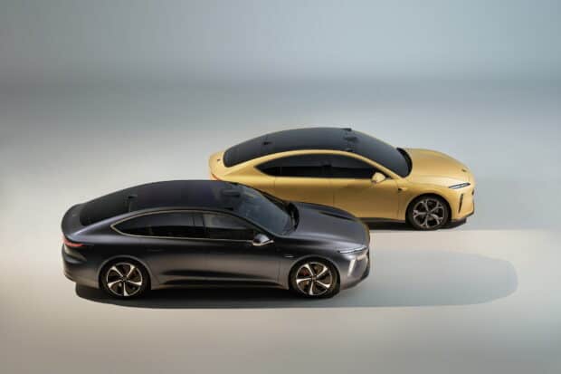 Modern Nio Auto designs in black and gold   Two Nio Auto vehicles stand side by side showing a sleek and modern design   HD Desktop Wallpaper