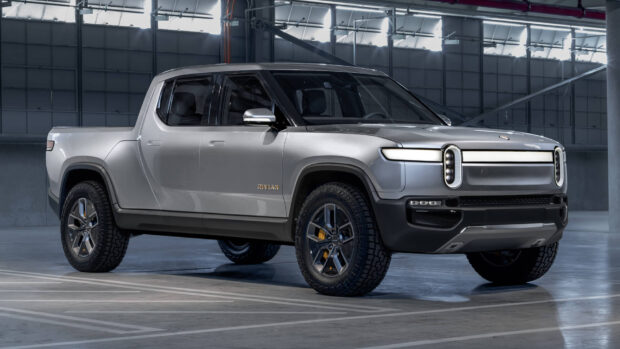 This Rivian automotive showcases a sleek silver design and rugged tires in an indoor setting, HD Desktop Wallpaper