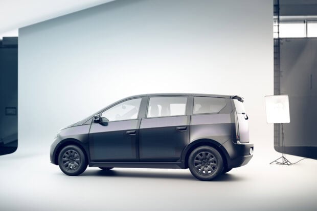 A sleek electric vehicle shown in a bright studio setting is featured in Sono Motors Wallpapers, HD Desktop Wallpaper