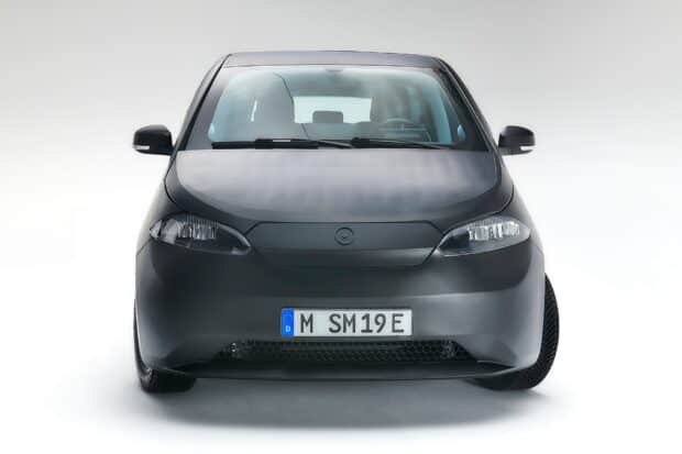 A black Sono Motors electric car is captured from the front with a clean white background, HD Desktop Wallpaper