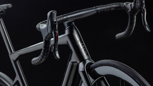 A close up of Bmc bikes frame and handlebars on a black background, HD Desktop Wallpaper