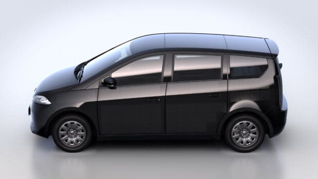 A side view of a modern black Sono Motors vehicle showing sleek design and solar panels, 2K Desktop Wallpaper