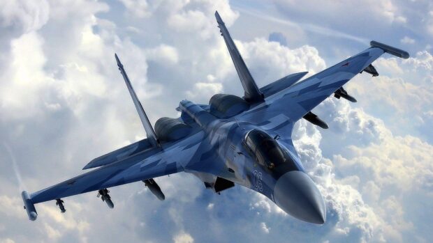 A modern jet fighter is soaring high above the clouds in clear sky, HD Desktop Wallpaper