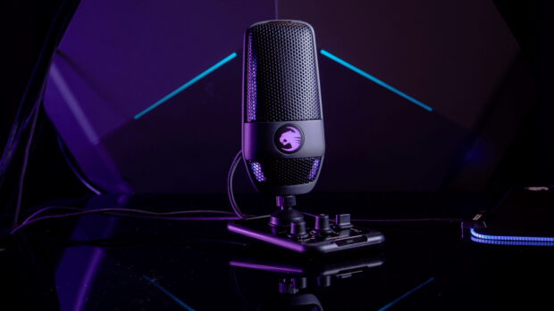 A modern microphone with purple lighting is placed on a control panel in a studio setting, HD Desktop Wallpaper