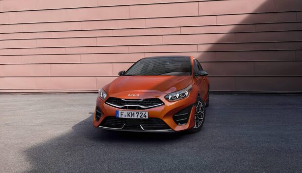A sleek Kia Wallpapers 4K and Full HD car in front of a tiled wall, HD Desktop Wallpaper