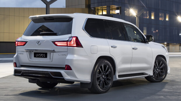 A white Lexus LX 570 SUV with black rims parked in an urban area at night, HD PC Wallpaper