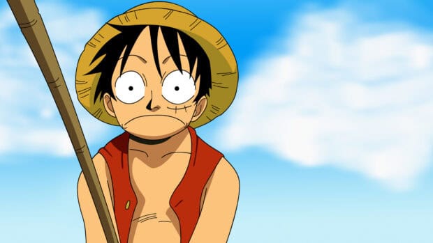 Monkey D Luffy stands with a serious expression against a blue sky, HD Desktop Wallpaper