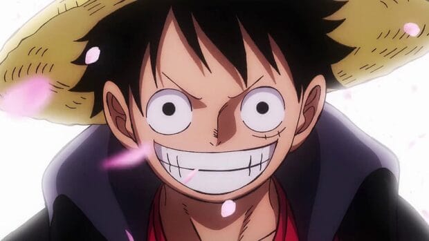 Monkey D Luffy with his iconic straw hat and a cheerful smile surrounded by pink petals, HD Desktop Wallpaper