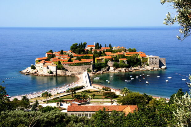 A scenic coastal island with red roofed buildings surrounded by the sea in Montenegro wallpapers, HD Desktop Wallpaper