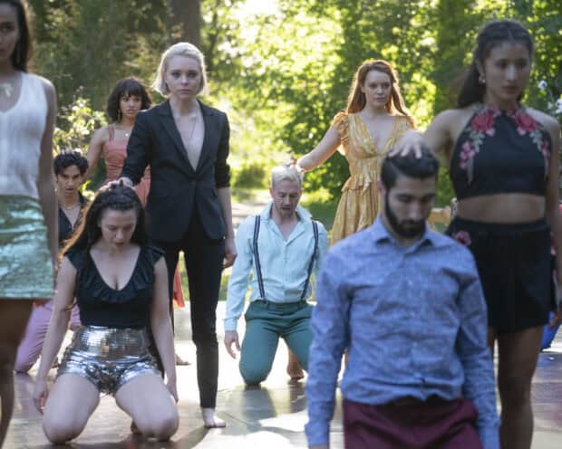 The Motherland Fort Salem cast performs a dramatic scene outdoors with intense focus, 2K Desktop Wallpaper