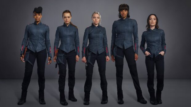 The Motherland Fort Salem cast stands confidently in their uniform against a neutral background, 4K Desktop Wallpaper