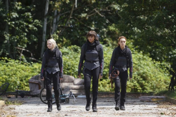 Three women in tactical gear walk on a path surrounded by trees in Motherland Fort Salem tv series, HD Desktop Wallpaper