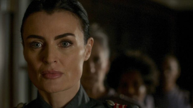 A close up of a serious woman from Motherland Fort Salem tv series with others blurred behind, HD Desktop Wallpaper