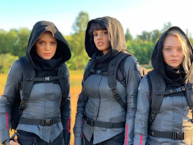 Three women stand together wearing tactical gear in a field for Motherland Fort Salem tv series, HD Desktop Wallpaper