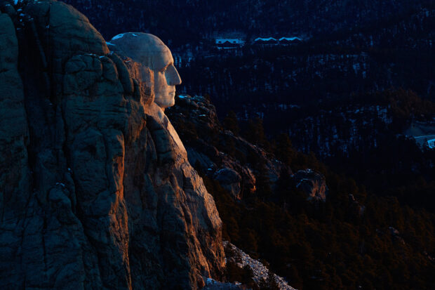 The Mount Rushmore carved faces are illuminated by the warm sunset light, HD Desktop Wallpaper