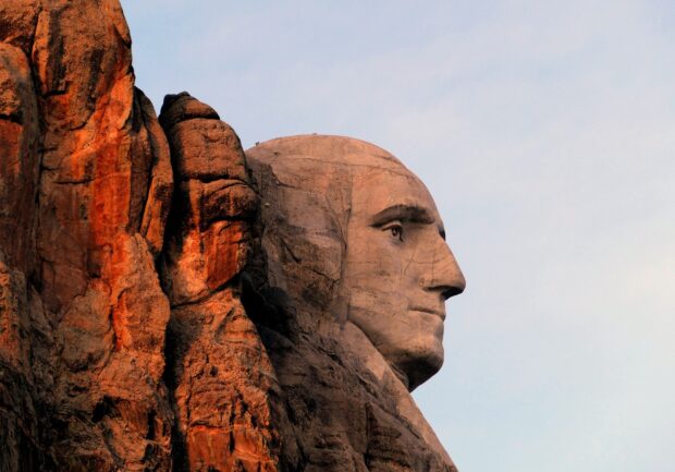 A closeup of Mount Rushmore with detailed stone carving on the face, HD Desktop Wallpaper