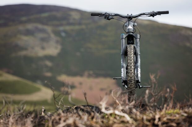 A close up of a Marin bike front tire and handlebars on a trail, HD Desktop Wallpaper