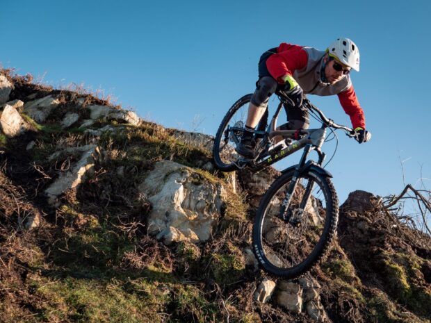 A man rides a Marin bike on a steep rocky mountain path, HD Desktop Wallpaper