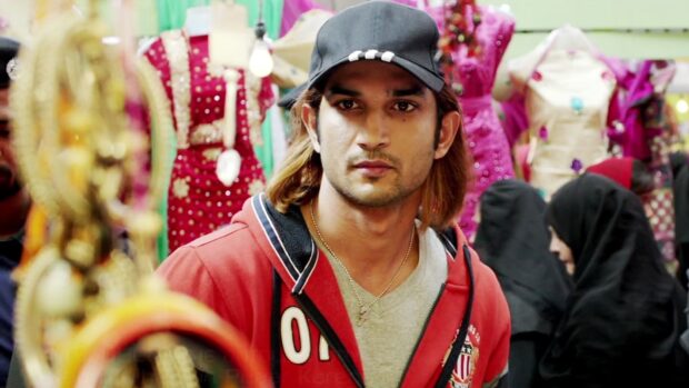 A close up of a man wearing a cap and red jacket in a busy market, HD Desktop Wallpaper
