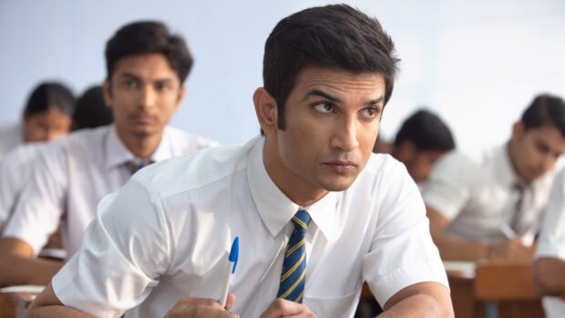A young man looks focused in a classroom scene from Ms Dhoni The Untold Story wallpapers, HD Desktop Wallpaper