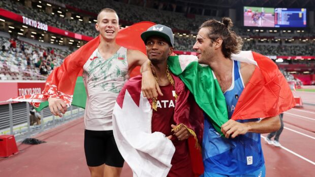 Mutaz Essa Barshim celebrating with fellow athletes after a competition, 2K Desktop Wallpaper