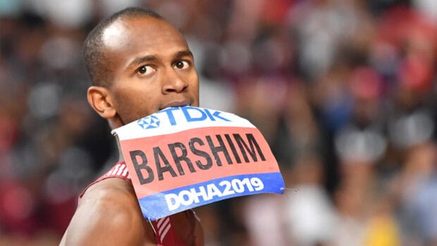 Mutaz Essa Barshim holding his race bib during an event, 4K Desktop Wallpaper