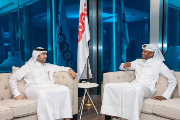 Mutaz Essa Barshim is seated and talking with a man in traditional clothing, 2K Desktop Wallpaper