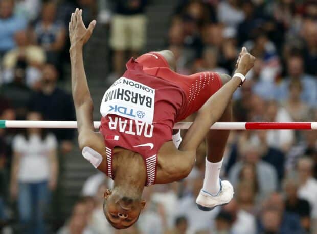Mutaz Essa Barshim is captured in mid air during a high jump competition, HD Desktop Wallpaper
