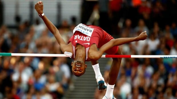 Mutaz Essa Barshim is captured mid jump during a high jump event, HD Desktop Wallpaper