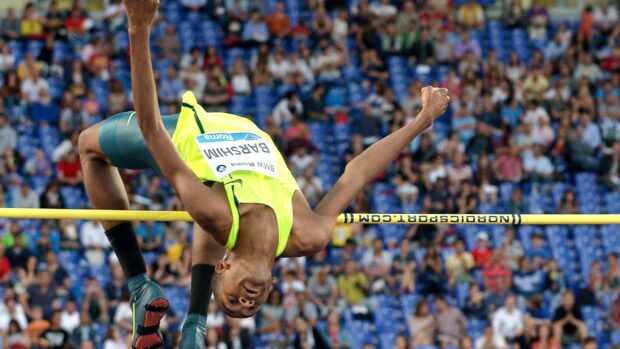 Mutaz Essa Barshim is seen clearing the high jump bar during a competition, 2K Desktop Wallpaper
