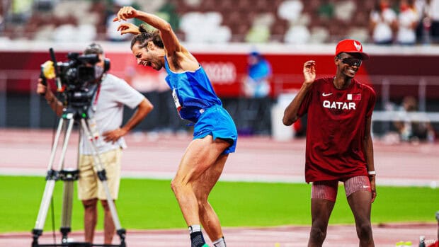 Mutaz Essa Barshim celebrates a joyful moment on the track wearing Qatar team uniform, HD Desktop Wallpaper