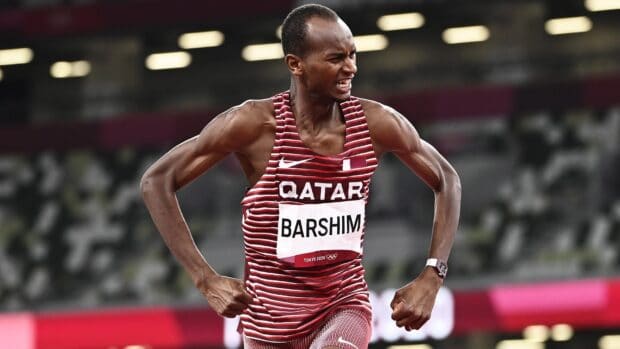 Mutaz Essa Barshim competes with effort and focus in a track event at the Tokyo 2020 Olympics, HD Desktop Wallpaper