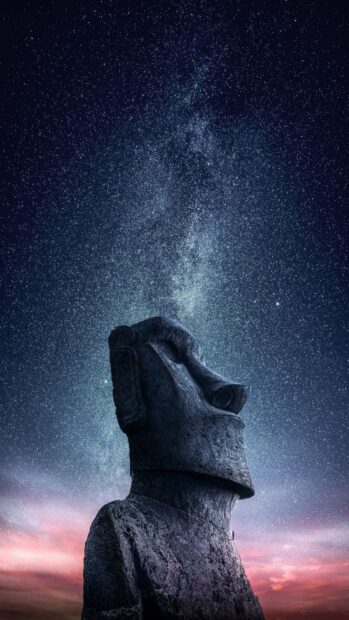 The Easter Island moai statue stands under a starry sky with colorful clouds, HD Mobile Wallpaper