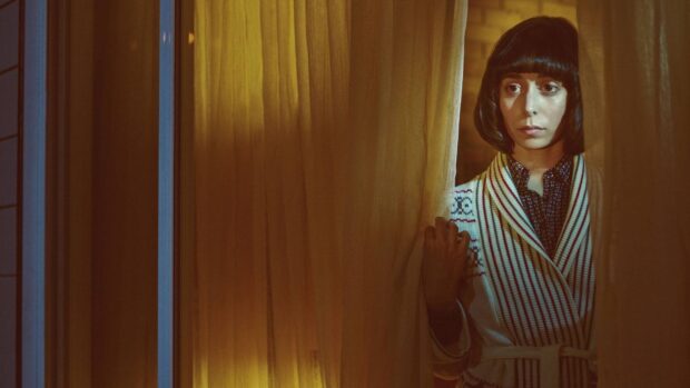 A woman in a retro outfit peeks through yellow curtains with a thoughtful expression in Fargo Wallpapers, HD Desktop Wallpaper