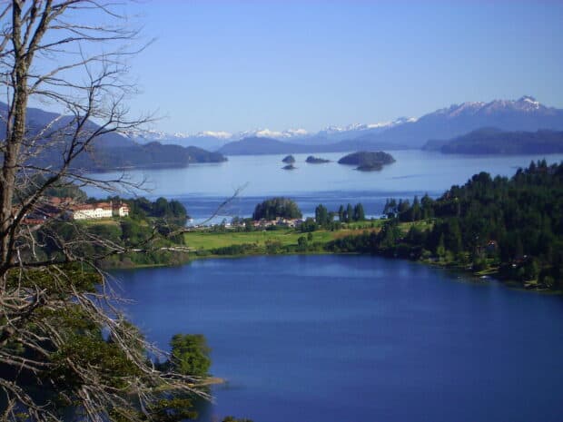 A peaceful view of Nahuel Huapi with clear water and distant snowy mountains, HD Desktop Wallpaper