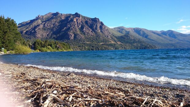 The Nahuel Huapi shows clear water with mountains and forest along the shore, 4K Desktop Wallpaper