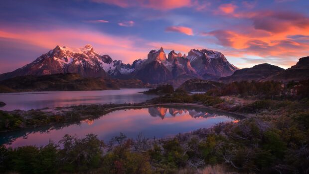 The Nahuel Huapi mountain range reflects on the lake water during sunset, 4K Desktop Wallpaper