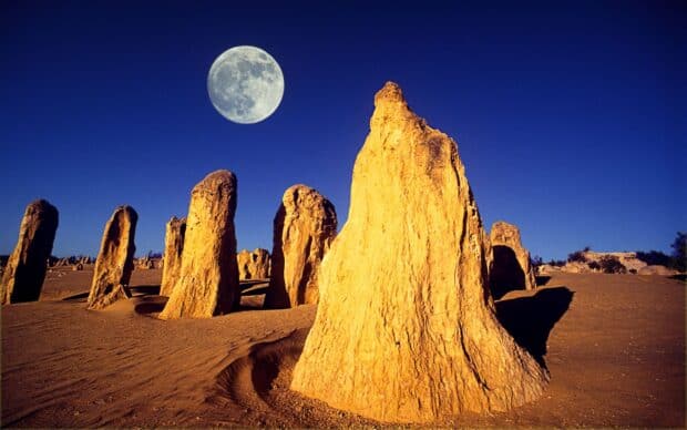 The Nambung National Park features tall rock formations under a bright full moon, HD Desktop Wallpaper