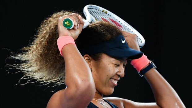 Naomi Osaka celebrating a tennis victory with a racket behind her head, 2K Desktop Wallpaper
