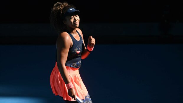 Naomi Osaka celebrates a win on the tennis court wearing a navy and pink outfit, 2K Desktop Wallpaper