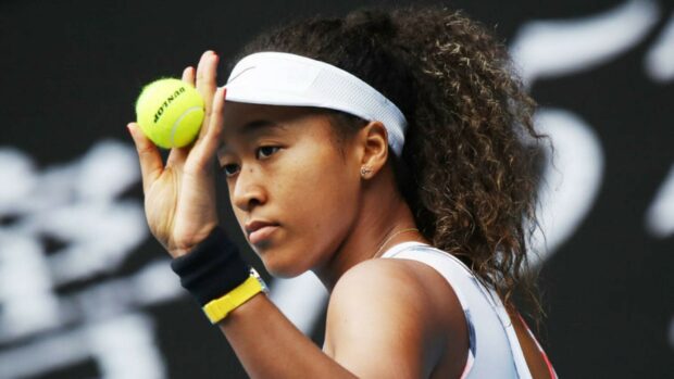 Naomi Osaka focused on serving the tennis ball during the match, HD Desktop Wallpaper