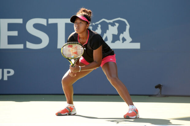 Naomi Osaka is ready to return a serve in a professional tennis game, 2K Desktop Wallpaper